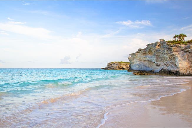 Stone Cliffs On The Beach Shore