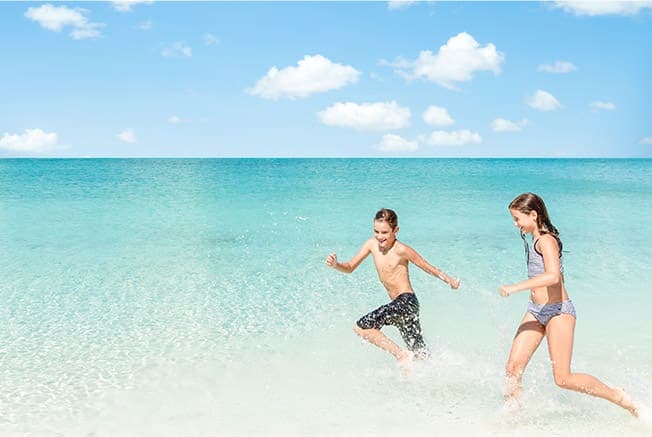Boy and Girl Playing at the Shore