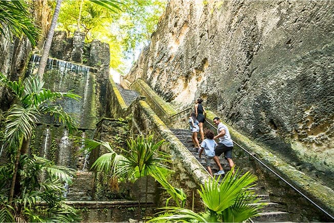 Family With Kids Walking Up The Queens Staircase