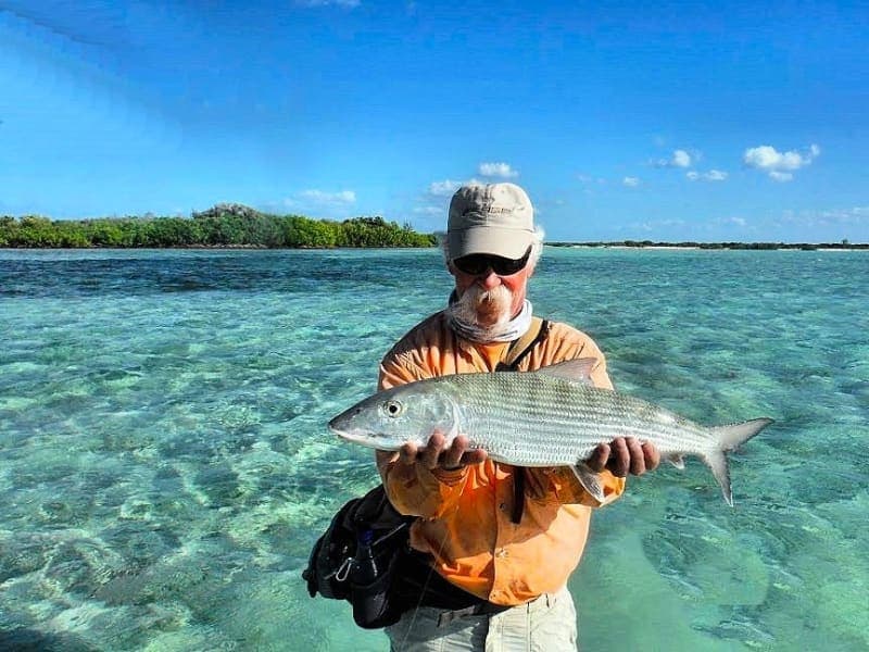 Angler with a bonefish on the Mayaguana flats