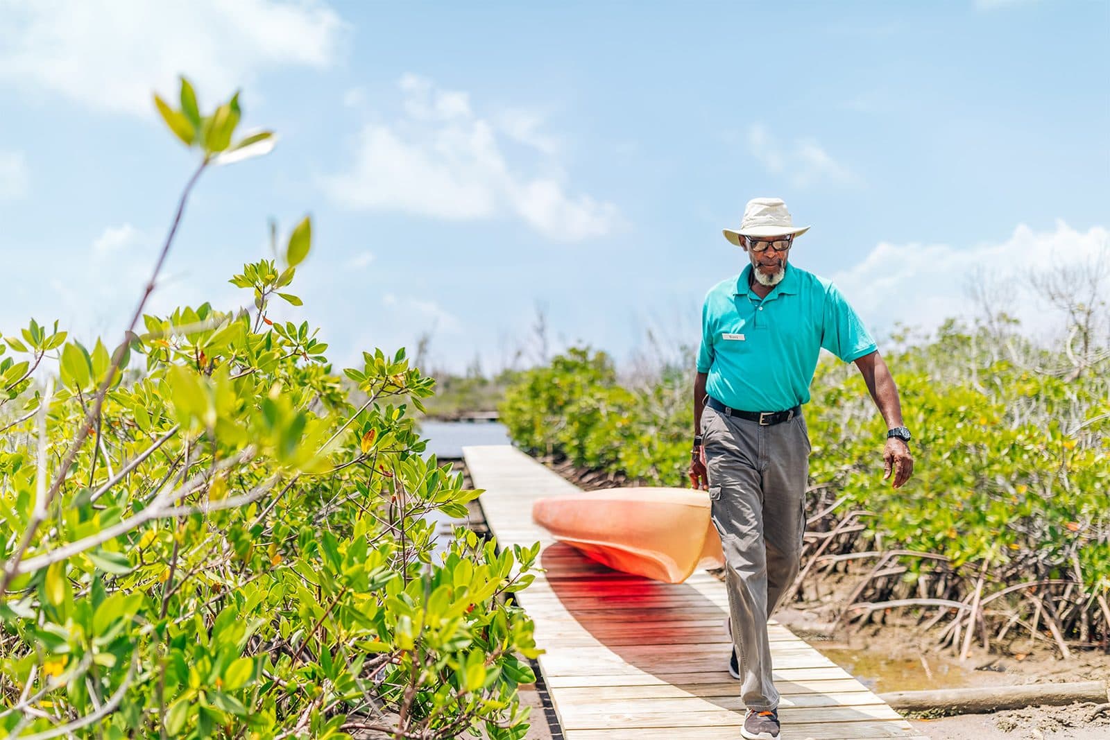 A guide walking the mangrove boardwalk in Lucayan National Park, Grand Bahama