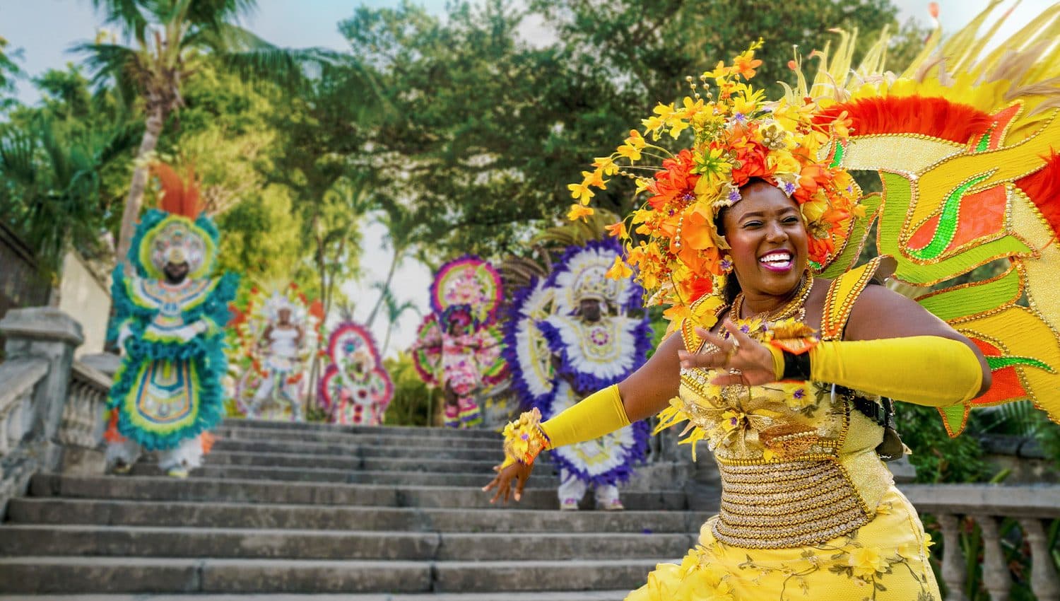 Junkanoo dancers in bright feathered costumes